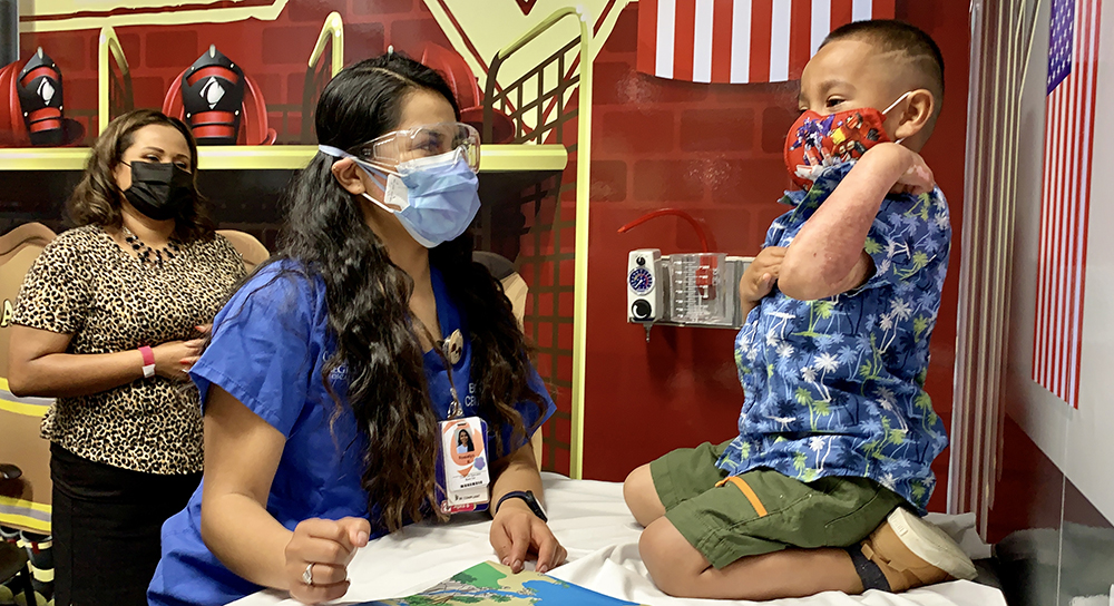 1000x544_Newsroom-MatthewPerez-with-BurnCenter-Child-Life-Specialist