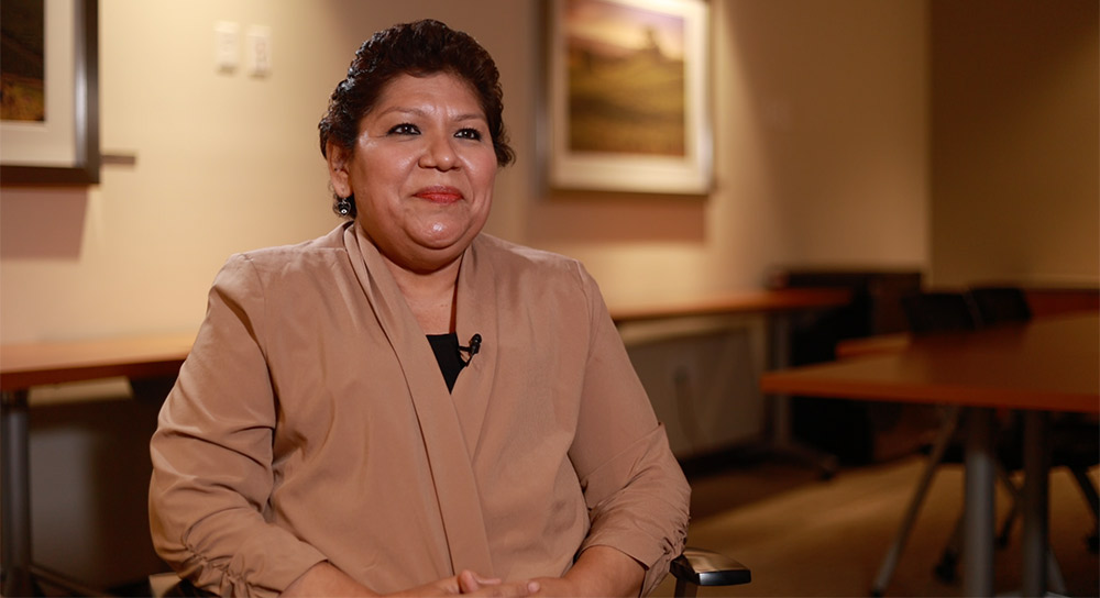 A woman sits in a chair