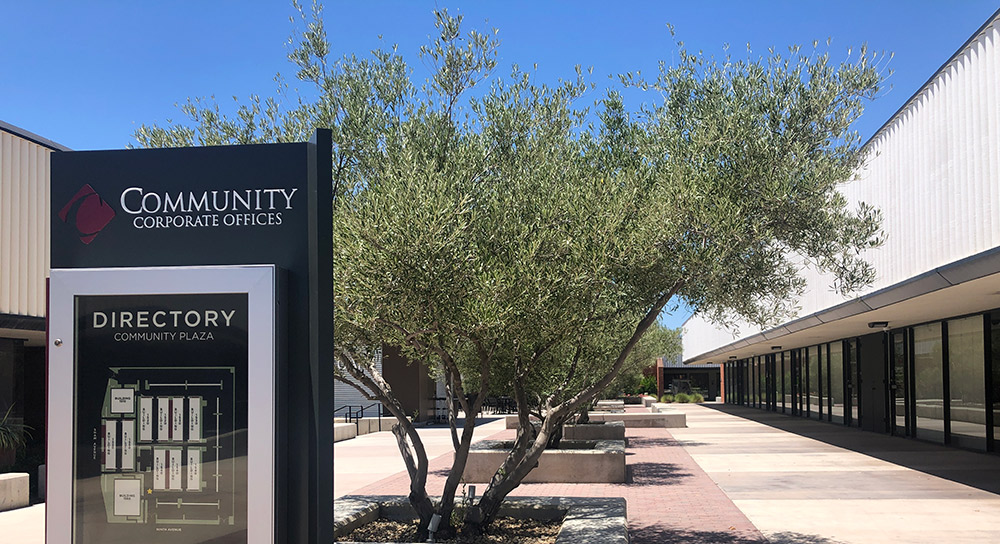 Shaw Plaza campus exterior is shown with directory sign in foreground