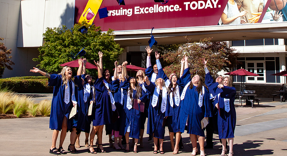 sonography graduates tossing their caps