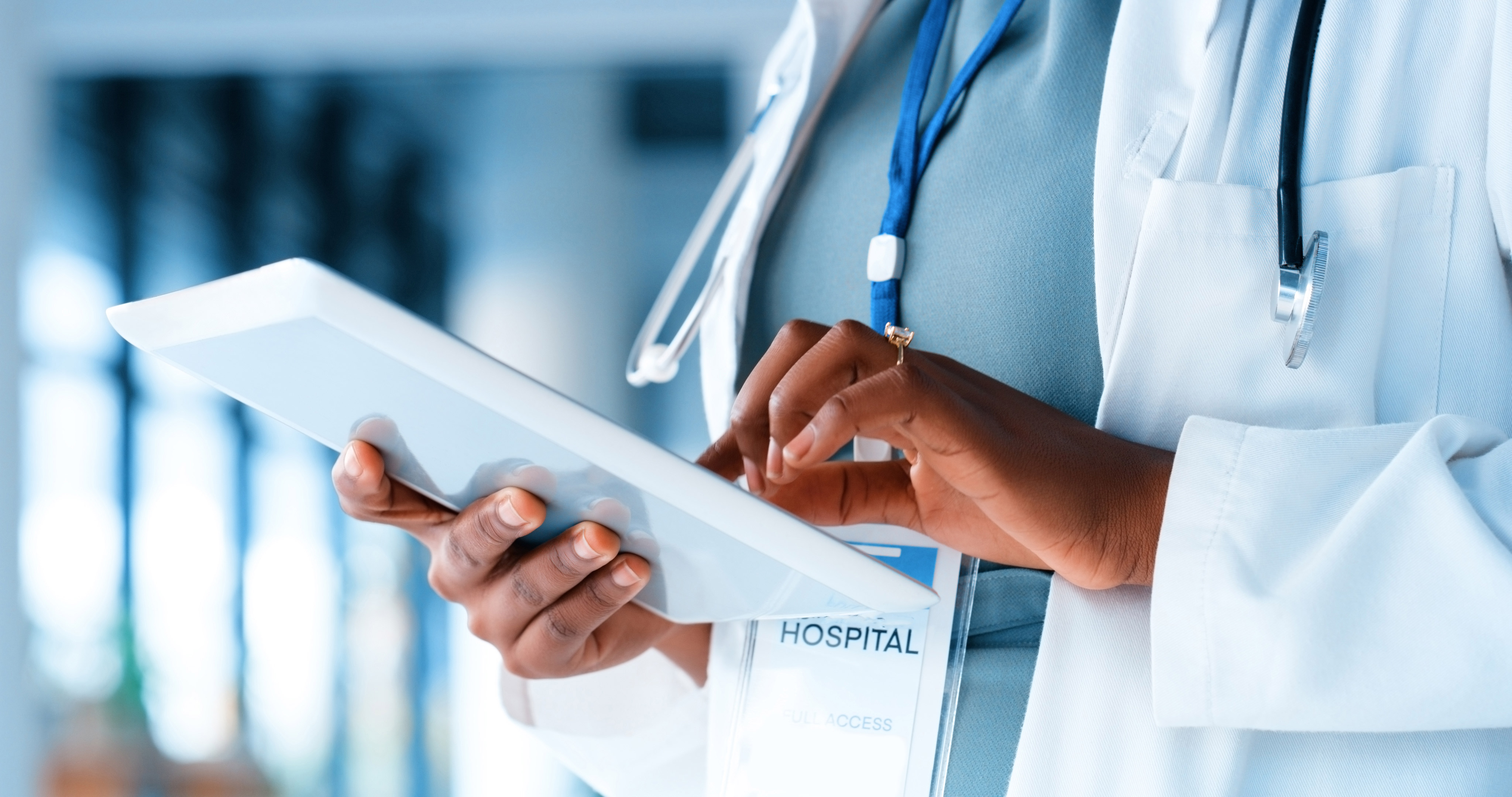 Close up of a female doctor's hands holding a tablet