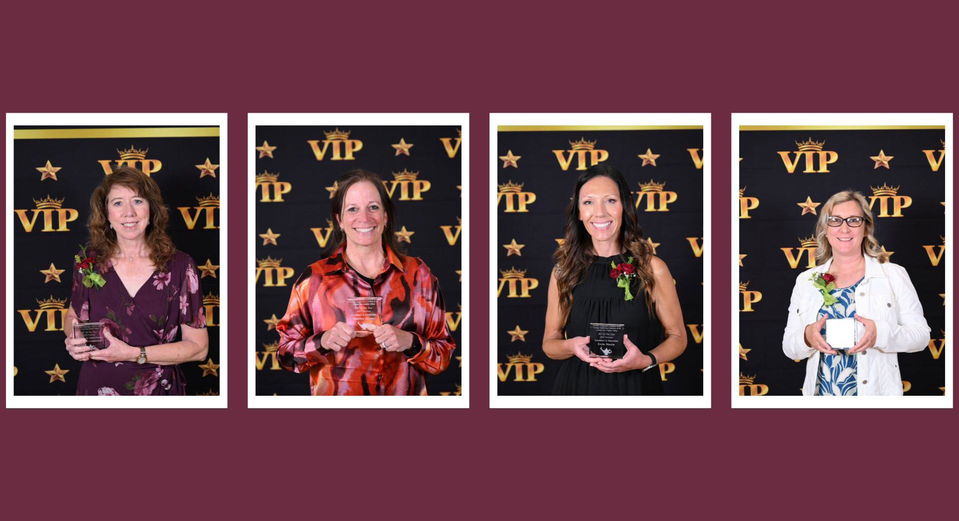 Four women hold their RN of the year awards and smile at the camera