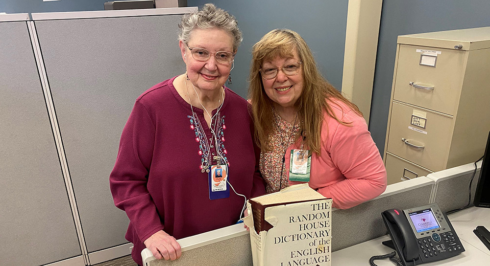 50-Year Employees Phyllis Scroggins and Linda Bush Standing in an office 